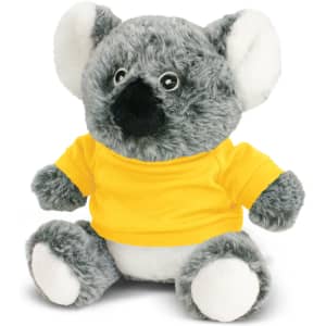 A grey koala plush toy wearing a yellow t-shirt, featuring a soft texture and round facial features.