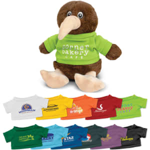 A brown kiwi plush toy wearing a green shirt with a logo, displayed alongside various brightly coloured miniature shirts.