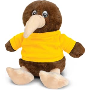 A brown kiwi plush toy wearing a bright yellow T-shirt, sitting upright with a large beak and soft feet.