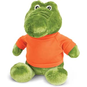 A green crocodile plush toy wearing an orange shirt, featuring a friendly expression and soft, fluffy texture.