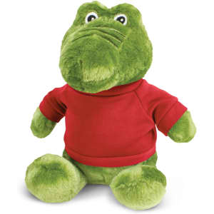 A green crocodile plush toy wearing a red shirt, featuring large eyes and a friendly expression.