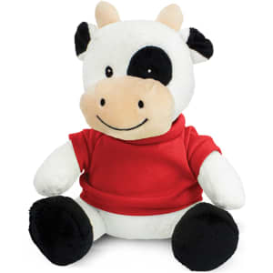 A cow plush toy with a white body, black spots, and a red shirt, featuring a friendly smiling face and soft fabric.