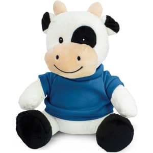 A plush cow toy with black and white fur, wearing a blue shirt. It has a smiling face and black hooves.
