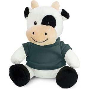 A cow plush toy in black and white, wearing a green shirt, with a smiling face and soft, cuddly features.