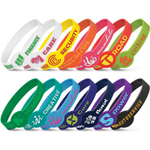 A selection of silicone wristbands in various colours, featuring embossed designs and logos.