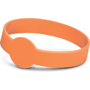 An orange silicone wristband featuring a round disc, designed to glow in the dark.