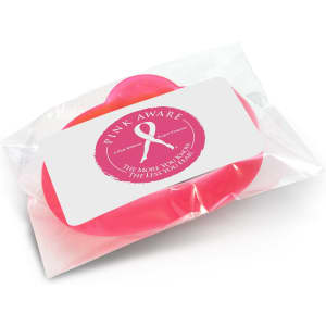 A pink silicone wristband packaged in clear plastic, featuring a logo and branding design.