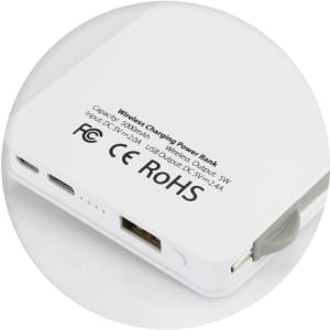 A white wireless charging power bank with USB ports and a branded logo. It features a sleek, compact design.