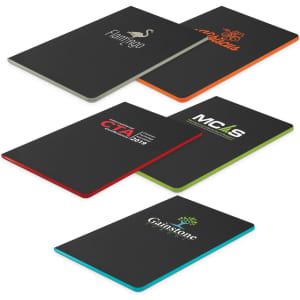 A set of five black notebooks with coloured edges, featuring various logos on the covers.
