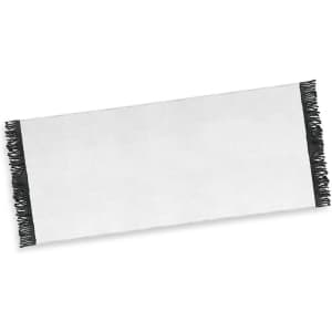A white beach towel with black fringed edges, featuring a logo or branding. Ideal for leisure and outdoor use.