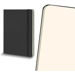 A large black hard cover notebook with an elastic band, featuring cream-coloured pages inside.