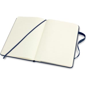 A medium Moleskine Classic hard cover notebook in navy blue, with blank pages and a ribbon placeholder.