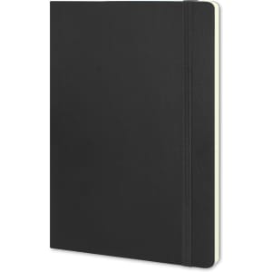 A large black soft cover notebook with an elastic band closure and a cream-coloured interior.