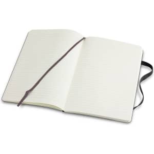 A large, soft cover Moleskine notebook with lined pages and a ribbon bookmark, featuring a black exterior.