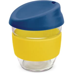 A drink bottle featuring a clear borosilicate glass body with a blue lid and a yellow silicone band.