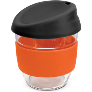 A drink bottle made of borosilicate glass with an orange silicone sleeve and a black lid.