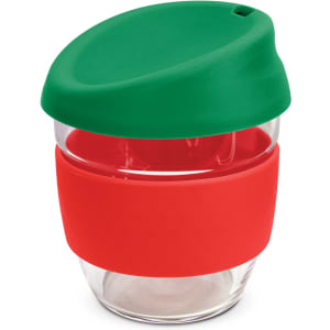 A drink bottle made of clear borosilicate glass with a green silicone lid and a red silicone band.