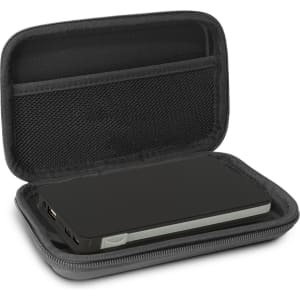 A green wireless charging power bank inside a black case, featuring a mesh pocket and zippers.