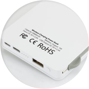 A white wireless charging power bank with ports and a small grey connector. It features a logo on the surface.