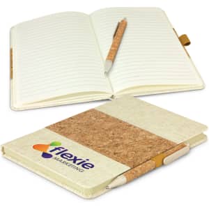 A notebook with a cork cover, featuring lined pages and a matching pen, displaying a logo on the front.