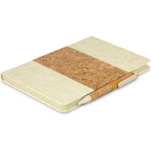 A beige notebook with a cork cover and matching pen set, featuring a simple design and a logo.