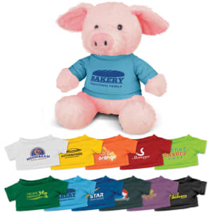 A pink pig plush toy wearing a blue shirt, surrounded by various coloured shirts showcasing different logos.