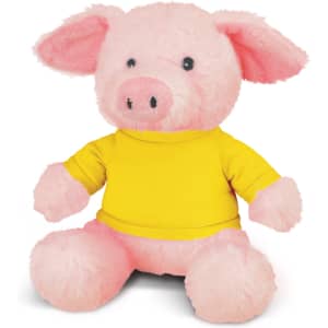 A pink pig plush toy wearing a yellow shirt, featuring soft textures and a friendly expression.