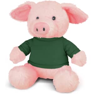 A pink pig plush toy with a green shirt, featuring soft fur and a friendly expression.