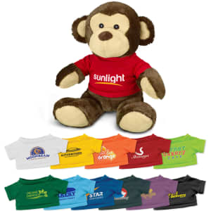 A brown and cream monkey plush toy wearing a red shirt with a logo, surrounded by small shirts in various colours.