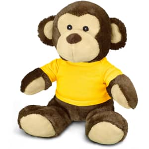 A plush monkey toy featuring brown fur and a yellow shirt, with round ears and a friendly face.