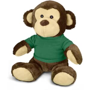 A brown monkey plush toy wearing a green shirt, featuring soft fur and a friendly expression.