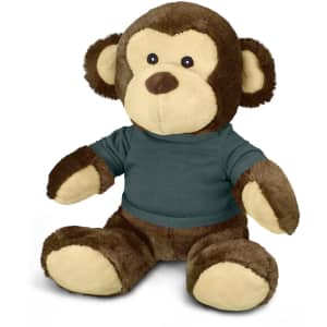 A brown and tan monkey plush toy wearing a green shirt, featuring cute facial details and soft limbs.