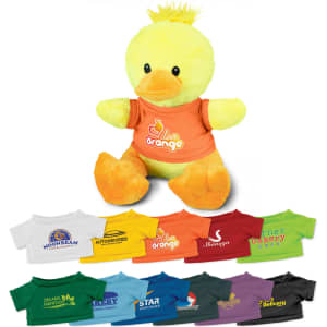 A yellow duck plush toy wearing an orange T-shirt, surrounded by various small T-shirts in different colours.