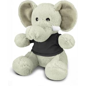 A grey elephant plush toy with large ears, wearing a black shirt, sitting upright. Featuring a logo on the shirt.