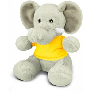 A grey elephant plush toy wearing a yellow shirt, with large ears and a friendly expression.