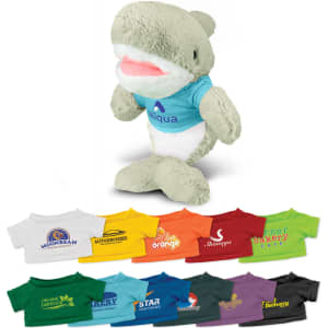 A plush shark toy in grey with a blue top, standing alongside a variety of colourful miniature t-shirts.