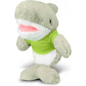 A plush toy shark in grey with a white belly, wearing a green shirt, featuring a logo on the shirt.