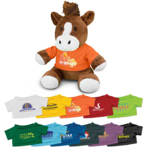 A brown horse plush toy wearing an orange shirt, accompanied by various other coloured shirts laid out below it.