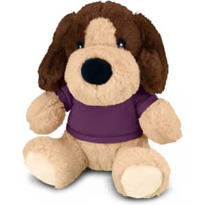 A plush dog toy featuring brown and beige fur, wearing a purple shirt with a logo on it.