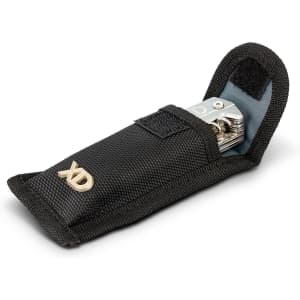 A black and grey multi-tool enclosed in a protective pouch, featuring a logo on the front.