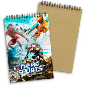 A medium spiral-bound notebook featuring a vibrant, multi-coloured cover with an extreme sports theme.