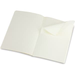 A large Moleskine Volant journal with blank lined pages, featuring a flexible cover in a cream colour.