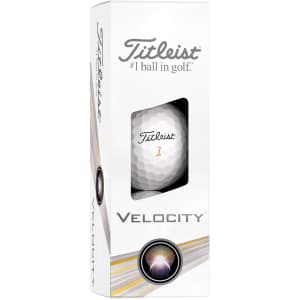 A white box containing Titleist Velocity golf balls, featuring a logo and a window displaying one golf ball inside.