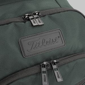A green backpack featuring two zippered compartments and a branding logo on the front.