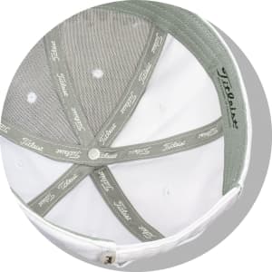 A white cap featuring a grey inner lining and a logo. Designed for golf, ideal for ball marking.