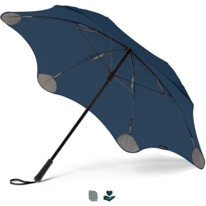 A navy blue BLUNT Coupe Umbrella with a black handle and a logo. The design features a unique shape and sturdy construction.