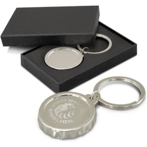 A drink bottle opener key ring in silver with a branded logo, displayed in a black gift box.
