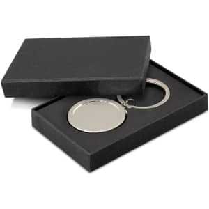 A drink bottle opener key ring in a sleek silver finish, presented in a black gift box.