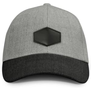 A grey cap with a dark grey peak, featuring a leather patch on the front.