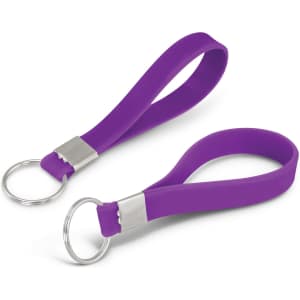A purple silicone key ring with a debossed design and a metal keyring attachment.